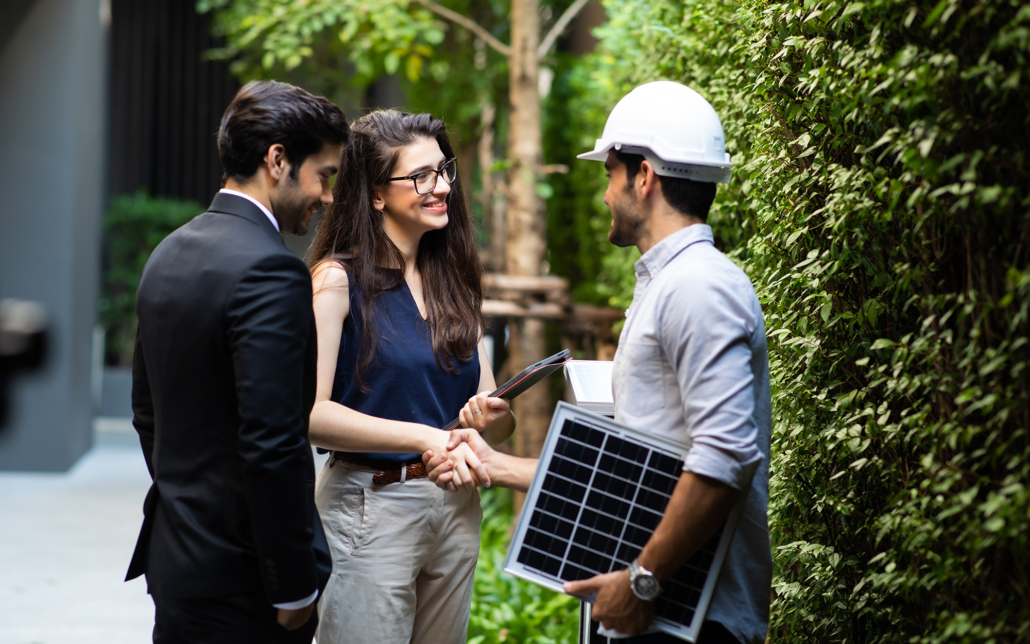 Electrician Shaking Hands With Business Owners